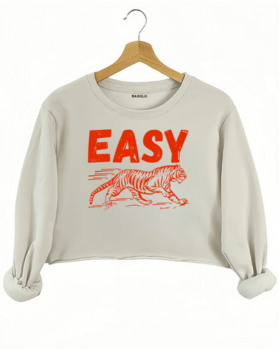 Ragglo beige crop sweatshirt featuring 'EASY' text with a running tiger graphic in red, perfect for playful streetwear and flirty, confident vibes.

