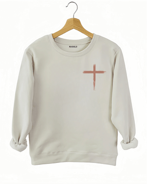 Ragglo beige sweatshirt front view featuring a rustic cross design, perfect for expressing Christian faith in a stylish casual look.

