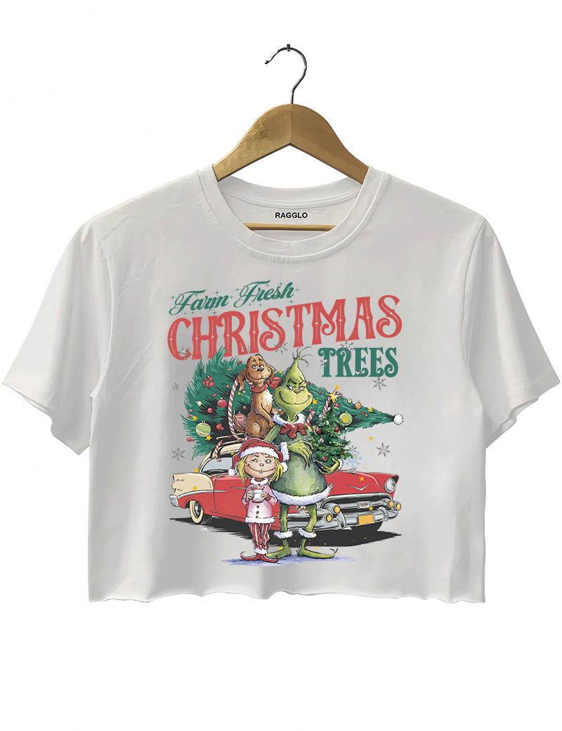Ragglo white crop top featuring The Grinch, Cindy Lou Who, and Max with a decorated Christmas tree and vintage car, with 'FARM FRESH CHRISTMAS TREES' text, perfect for festive holiday streetwear.

