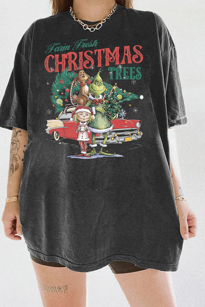 Ragglo dark gray tee featuring The Grinch, Cindy Lou Who, and Max with a decorated Christmas tree and vintage car, with 'FARM FRESH CHRISTMAS TREES' text, perfect for festive holiday streetwear.

