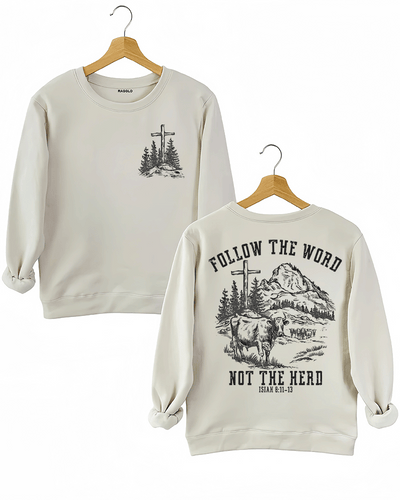 Ragglo beige women's sweatshirt featuring a minimalist cross and trees design on the front, and a mountain landscape with cattle, a cross, and trees on the back with the text 'Follow The Word Not The Herd' and 'Isaiah 8:11-13' in a faith-inspired graphic design.