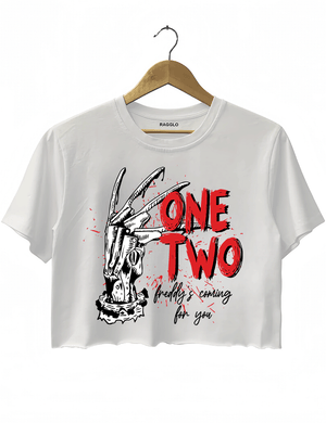 Ragglo white women's crop top with Freddy Krueger claw graphic and "One Two Freddy's Coming For You" text, inspired by A Nightmare on Elm Street horror theme.

