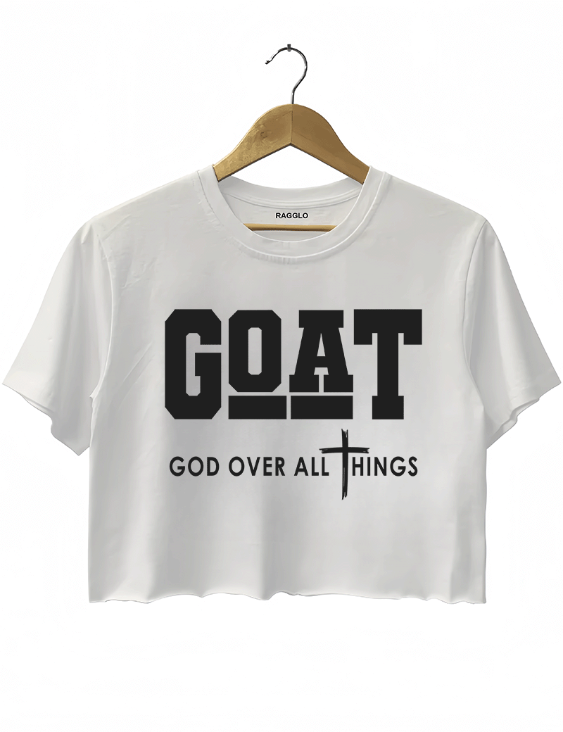 Ragglo white crop top with "GOAT God Over All Things" text and cross symbol in white, featuring a Christian faith-inspired design.

