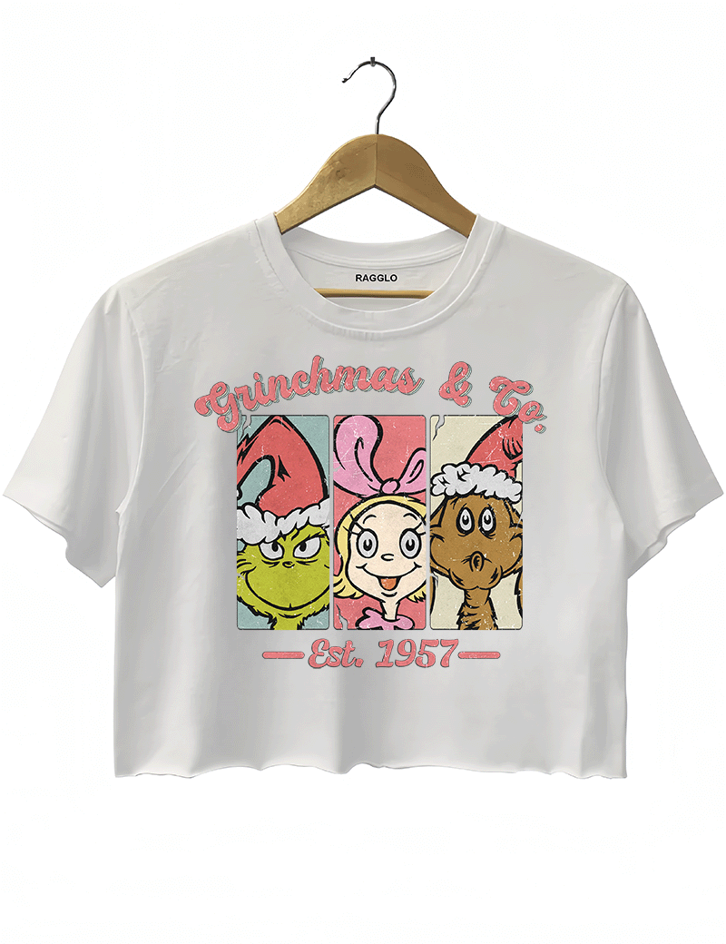 Ragglo white crop top featuring The Grinch, Cindy Lou Who, and Max in Santa hats with 'GRINCHMAS & GO' text and 'EST. 1957', perfect for festive holiday streetwear and Grinch fans.

