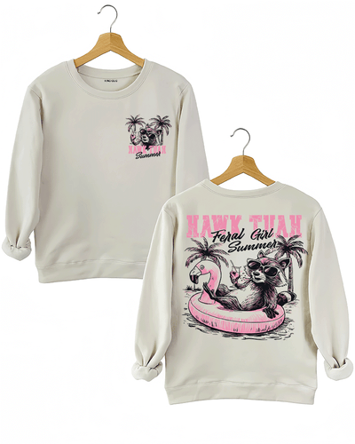 Ragglo beige sweatshirt front and back view, featuring a raccoon in sunglasses on a flamingo float with 'HAWK TUAH FERAL GIRL SUMMER' text and palm trees, perfect for playful vacation streetwear.

