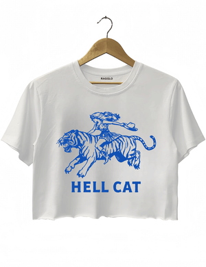 Ragglo white crop top featuring 'HELL CAT' text in blue with a graphic of a woman riding a tiger, perfect for bold streetwear and fierce, rebellious vibes.



