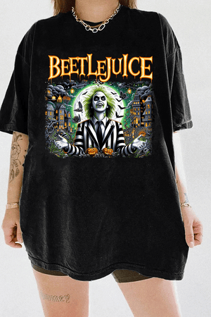 Ragglo black tee featuring Beetlejuice in a black-and-white striped suit, with a haunted house, bats, and pumpkins in the background, with 'BEETLEJUICE' text, perfect for Halloween streetwear and movie fans.

