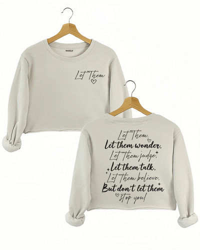 Ragglo beige women's crop sweatshirt featuring 'Let Them' with a heart on the front and the motivational text 'Let Them Wonder, Let Them Judge, Let Them Talk, Let Them Believe, But Don’t Let Them Stop You!' with a heart on the back, in an empowering graphic design.
