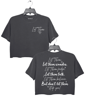 Ragglo dark gray women's crop top featuring 'Let Them' with a heart on the front and the motivational text 'Let Them Wonder, Let Them Judge, Let Them Talk, Let Them Believe, But Don’t Let Them Stop You!' with a heart on the back, in an empowering graphic design