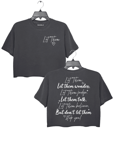 Ragglo dark gray women's crop top featuring 'Let Them' with a heart on the front and the motivational text 'Let Them Wonder, Let Them Judge, Let Them Talk, Let Them Believe, But Don’t Let Them Stop You!' with a heart on the back, in an empowering graphic design