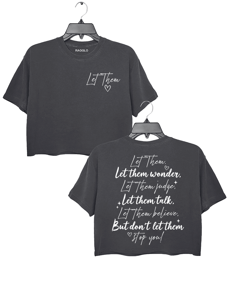 Ragglo dark gray women's crop top featuring 'Let Them' with a heart on the front and the motivational text 'Let Them Wonder, Let Them Judge, Let Them Talk, Let Them Believe, But Don’t Let Them Stop You!' with a heart on the back, in an empowering graphic design