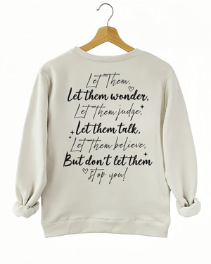 Ragglo beige women's sweatshirt back featuring the motivational text 'Let Them Wonder, Let Them Judge, Let Them Talk, Let Them Believe, But Don’t Let Them Stop You!' with a heart in an inspiring graphic design.