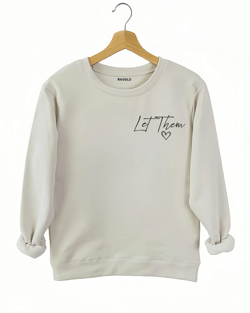 Ragglo beige women's sweatshirt front featuring the text 'Let Them' with a small heart in an empowering minimalist design.