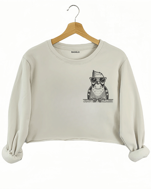 Ragglo beige crop sweatshirt front view showcasing a cool bird with sunglasses and a beard leaning on a ledge, perfect for humorous and trendy streetwear fashion.

