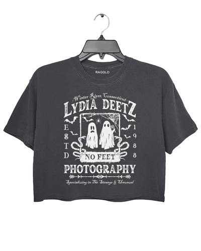 Ragglo dark gray crop top with "Lydia Deetz Photography No Feet" graphic featuring two ghosts, inspired by Beetlejuice with a gothic and supernatural theme.


