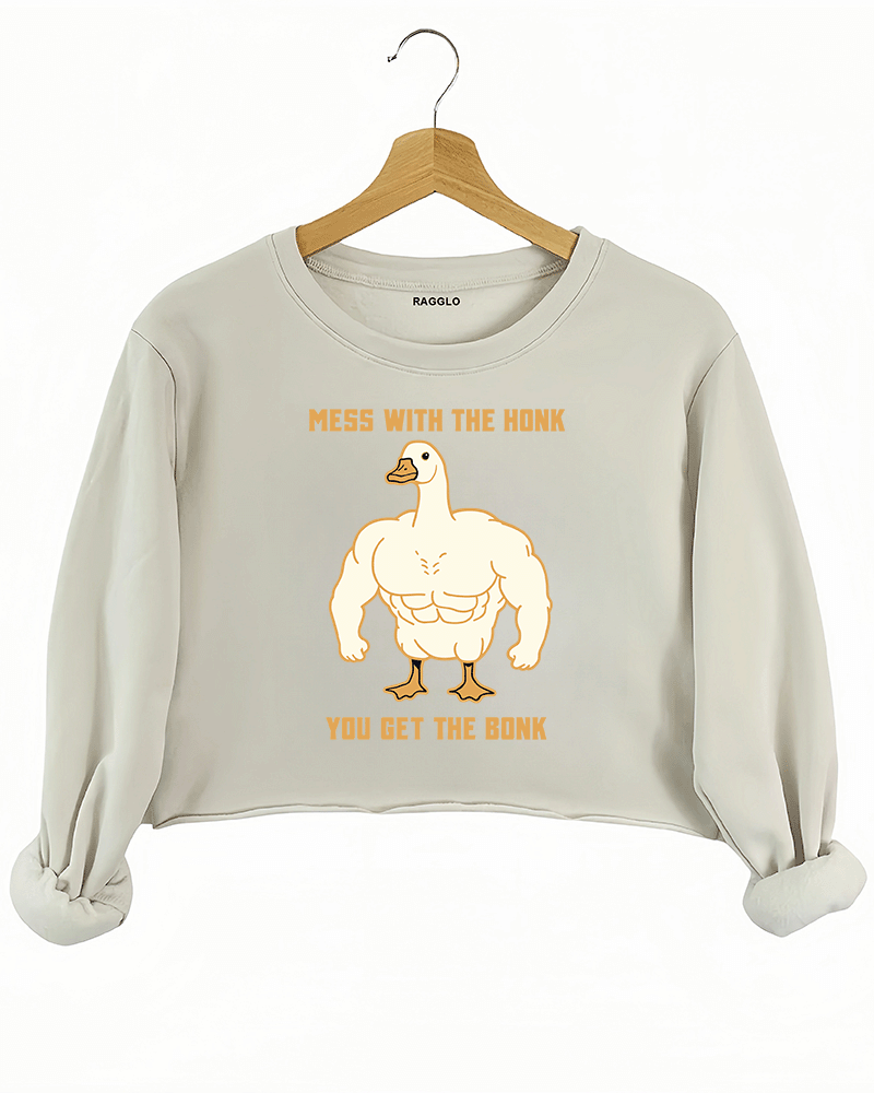 Ragglo beige crop sweatshirt with muscular goose graphic and "Mess With The Honk You Get The Bonk" text, featuring a humorous and bold animal meme theme.

