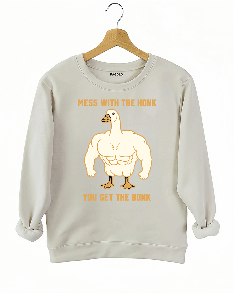 Ragglo beige sweatshirt with muscular goose graphic and "Mess With The Honk You Get The Bonk" text, featuring a humorous and bold animal meme theme.

