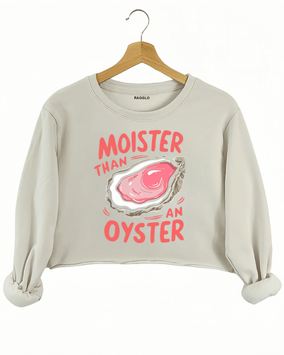Ragglo beige crop sweatshirt featuring 'MOISTER THAN AN OYSTER' text with an oyster graphic, perfect for cheeky streetwear and playful, flirty vibes.
