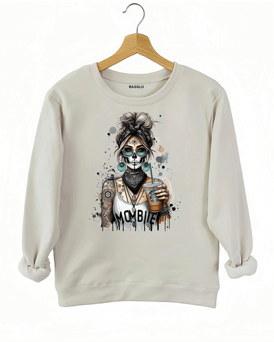 Ragglo MomBae Day of the Dead sweatshirt featuring a stylish sugar skull woman with a headscarf, holding a coffee cup, and wearing a 'MomBae' top with tattoo-inspired splashes, in a humorous and trendy Dia de los Muertos graphic design.