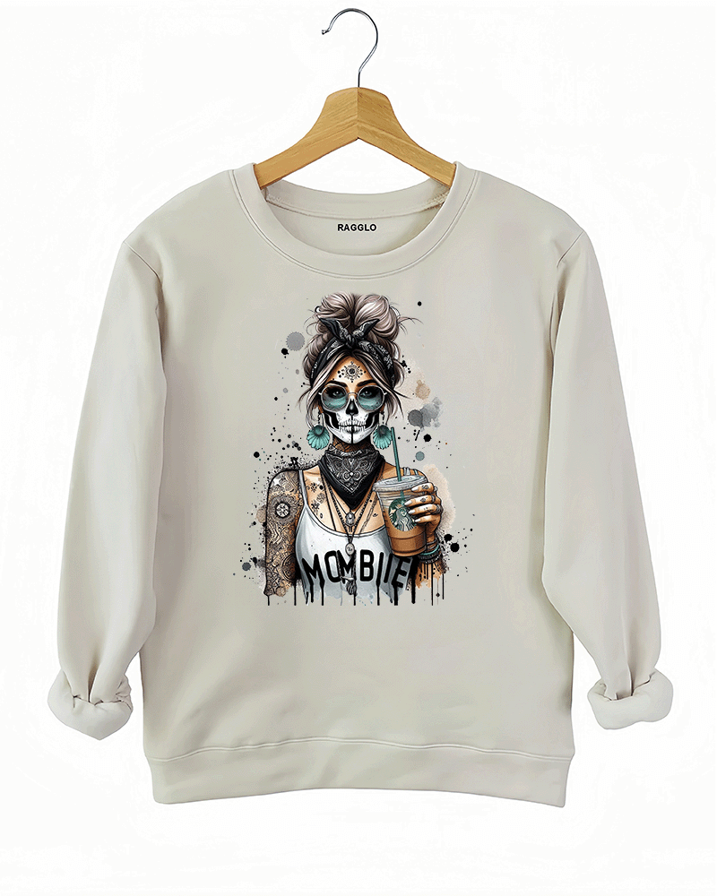 Ragglo MomBae Day of the Dead sweatshirt featuring a stylish sugar skull woman with a headscarf, holding a coffee cup, and wearing a 'MomBae' top with tattoo-inspired splashes, in a humorous and trendy Dia de los Muertos graphic design.
