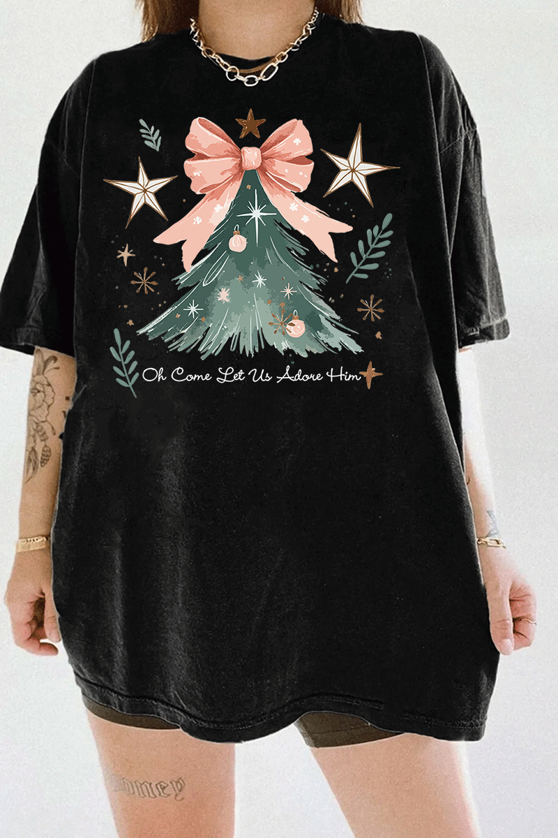 Ragglo black tee featuring a Christmas tree with a pink bow, stars, snowflakes, and branches, with 'Oh Come Let Us Adore Him' text, perfect for religious Christmas streetwear.







