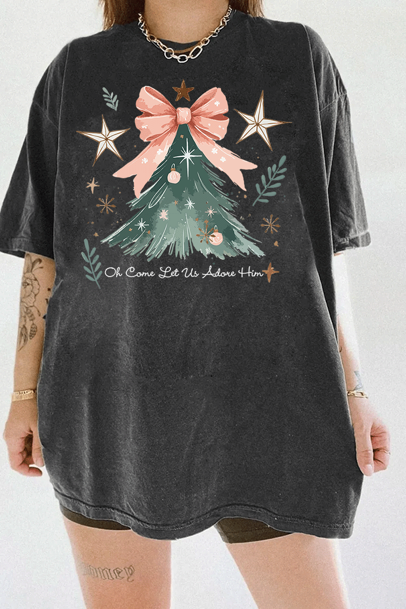 Ragglo dark gray tee featuring a Christmas tree with a pink bow, stars, snowflakes, and branches, with 'Oh Come Let Us Adore Him' text, perfect for religious Christmas streetwear.





