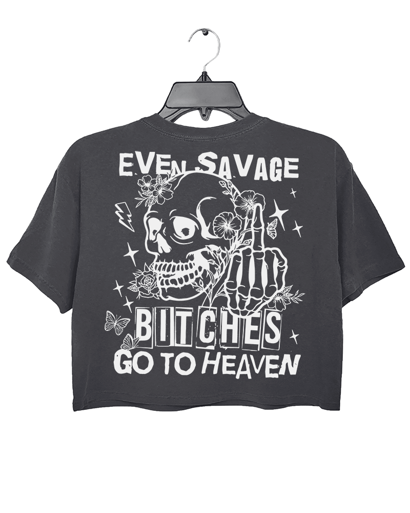 Ragglo dark gray crop top back view featuring a skull with a skeleton hand giving a middle finger, surrounded by flowers, butterflies, and stars, with 'EVEN SAVAGE BITCHES GO TO HEAVEN' text, perfect for humorous streetwear.

