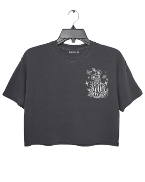 Ragglo dark gray crop top front view featuring a skeleton hand with a middle finger gesture surrounded by flowers, butterflies, and stars, perfect for bold streetwear style.

