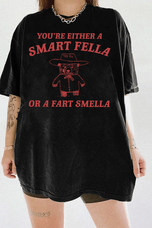 Ragglo black tee featuring 'YOU’RE EITHER A SMART FELLA OR A FART SMELLA' text with a bear in a cowboy hat, perfect for casual streetwear and humorous everyday wear.

