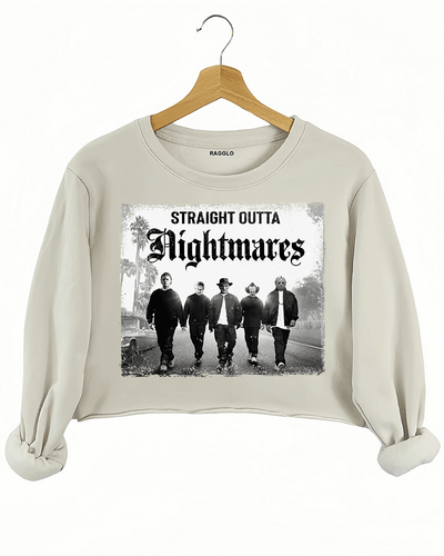 Ragglo beige crop sweatshirt with "Straight Outta Nightmares" graphic featuring five figures on a road, blending horror movie and hip-hop culture themes.

