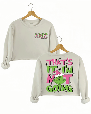 Ragglo beige women's crop sweatshirt featuring three Grinch characters with Santa hats on the front with 'Oh, That’s It I’m Trippin'' text, and a large Grinch with Santa hat on the back with 'That’s It I’m Not Going' text, in a humorous Christmas graphic design.