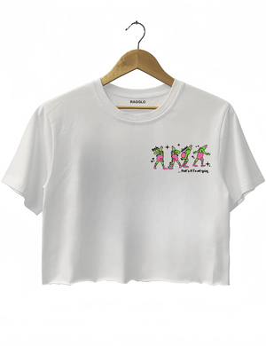 Ragglo white women's crop top front featuring three Grinch characters with Santa hats and the text 'Oh, That’s It I’m Trippin'' in a funny Christmas graphic design.