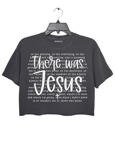 Ragglo dark gray crop top with "There Was Jesus" text in white, featuring a Christian faith-inspired design with spiritual lyrics.

