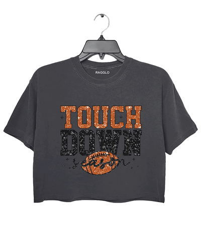 Ragglo dark gray crop top featuring 'TOUCH DOWN' text with a football graphic and 'season' script, accented by stars, perfect for football fans and game day streetwear.

