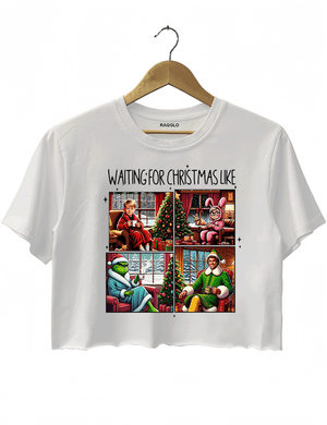 Ragglo white crop top featuring four classic Christmas movie characters waiting by decorated trees with 'WAITING FOR CHRISTMAS LIKE' text, perfect for festive holiday streetwear and movie fans.

