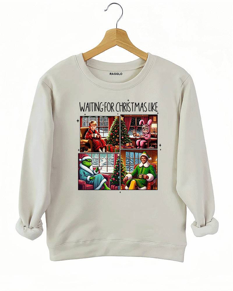 Ragglo beige sweatshirt featuring four classic Christmas movie characters waiting by decorated trees with 'WAITING FOR CHRISTMAS LIKE' text, perfect for festive holiday streetwear and movie fans.

