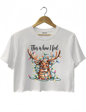 White crop top showcasing a confused reindeer wrapped in bright Christmas lights, with the fun phrase 'This is how I feel,' available on Ragglo.